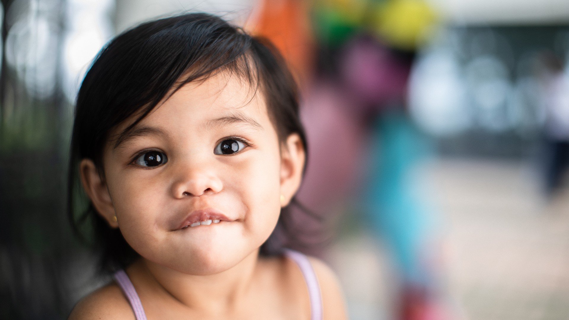 Young girl smiling in hallway