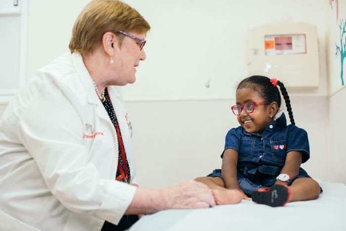 Provider examining young patient