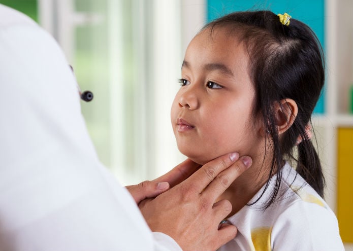 Young girl getting her lymph nodes checked