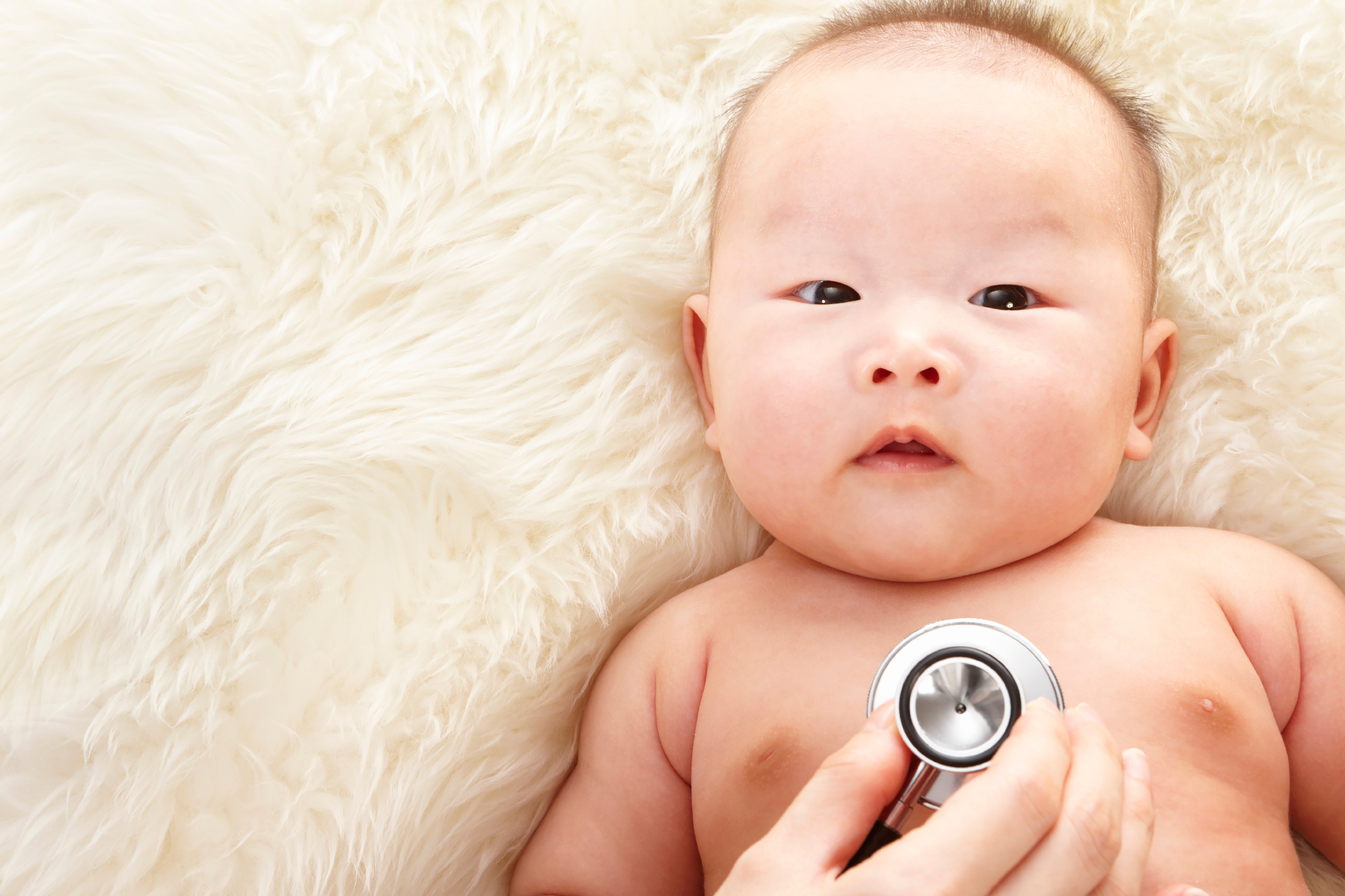 A baby with a stethoscope.