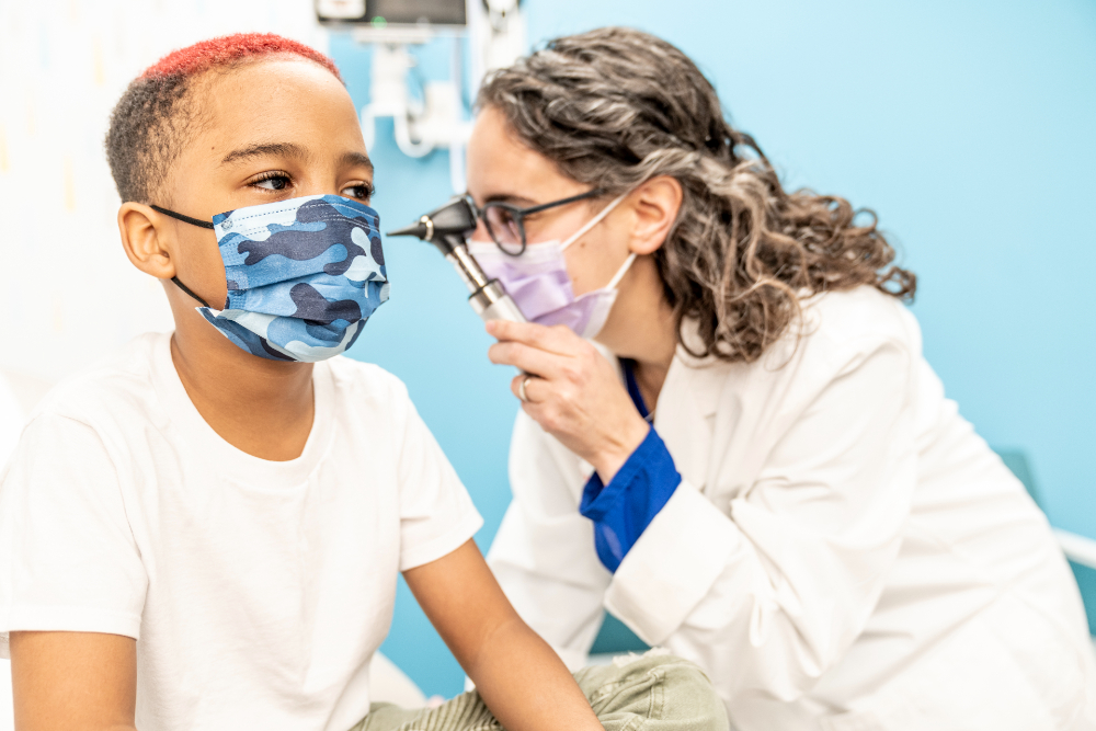 Dr. Smiley examines young patient