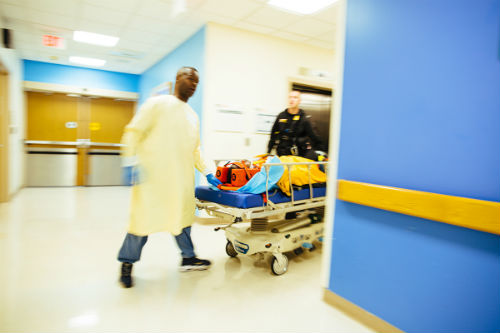 Patient being wheeled into Children's National Pediatric Level I Trauma Center for emergency trauma and burn surgery.