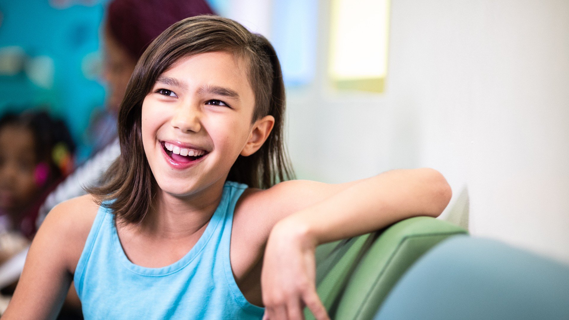 Young girl smiling in waiting room