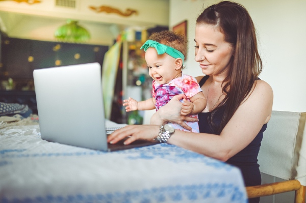 mother with baby at a computer