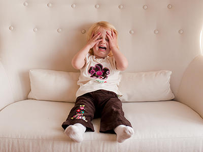 child crying on the couch