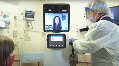 Robot with video screen with Doctor talking to patients remotely
