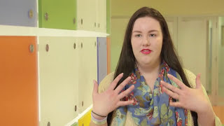 Maria gestures with her hands as she discusses her weight loss journey