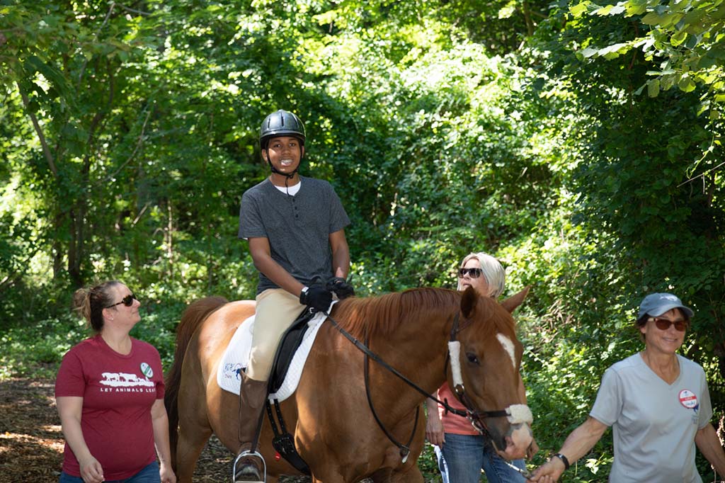 boy riding a horse