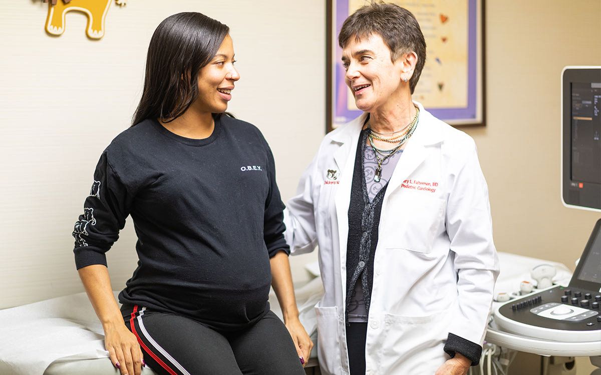 A prenatal practitioner meets with a pregnant patient.