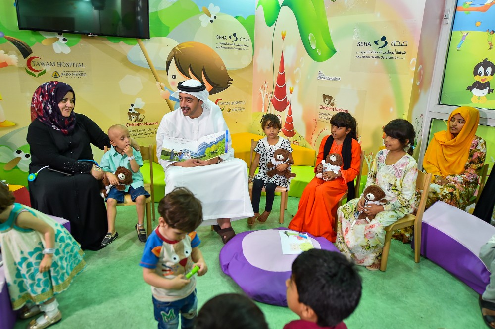 His Highness Sheikh Abdullah reading to children